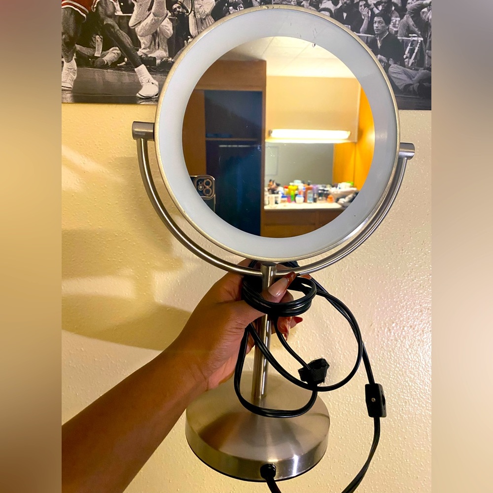 Mirror with lights around. Can be used as a desk lamp or a beauty lamp.